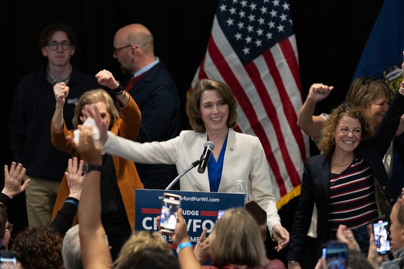 Dane County Circuit Court Judge Susan Crawford (C) reacts with supporters after her victory in the race for Wisconsin Supreme Court justice during an election night event on April 01, 2025 in Madison, Wisconsin.