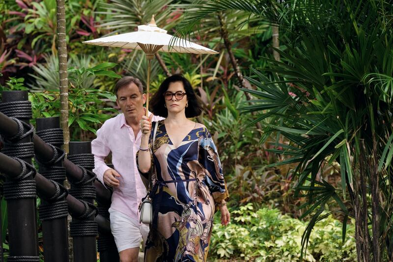 Jason Isaacs and Parker Posey
