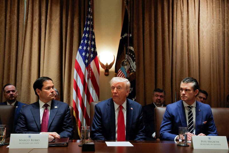 U.S. President Donald Trump hosts his first cabinet meeting with Elon Musk in attendance as he sits next to Secretary of State Marco Rubio and Defense Secretary Pete Hegseth, in Washington, D.C.,  U.S., February 26, 2025. REUTERS/Brian Snyder