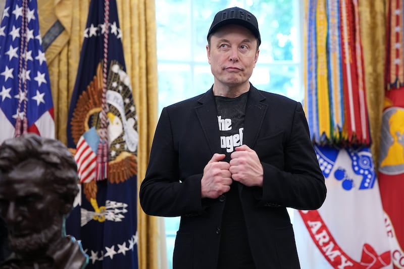 Elon Musk, sporting a black eye given to him by his son X, listens as President Donald Trump speaks to reporters in the Oval Office of the White House on May 30, 2025.