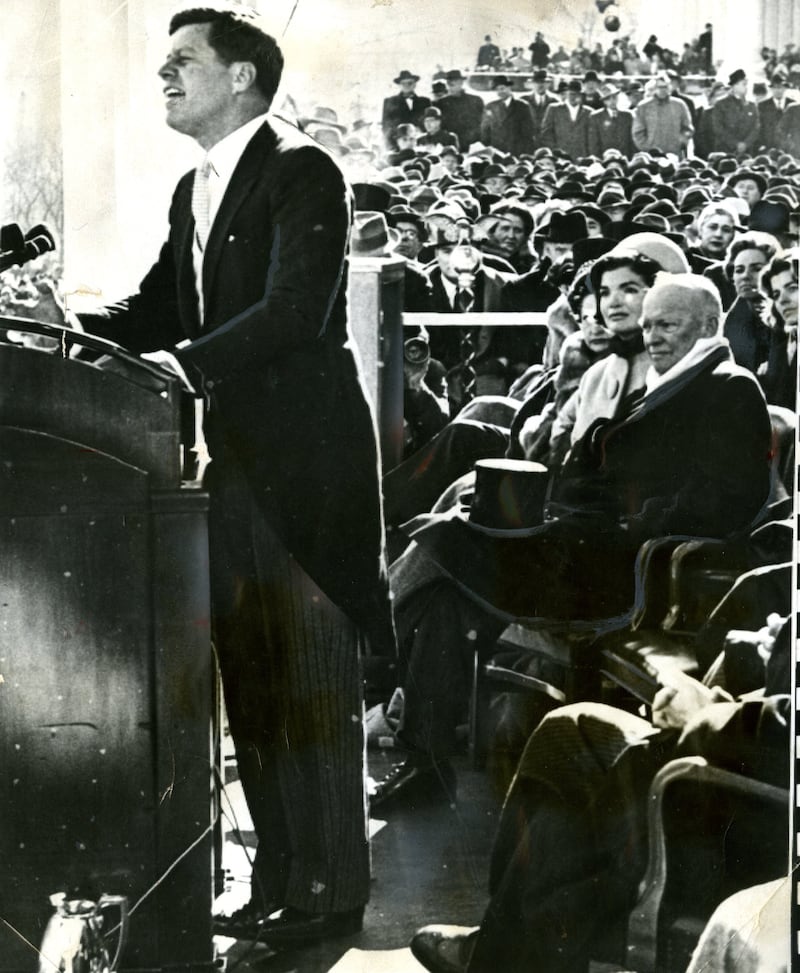WASHINGTON, DC - JANUARY 20:  President John F Kennedy (1917 - 1963) delivers his inaugural address, Washington DC, January 20, 1961. Among those seated are First Lady Jacqueline Kennedy (nee Bouvier, later Onassis, 1929 – 1994) and outgoing President Dwight Eisenhower (1890 - 1969). (Photo by Boston Globe Staff/The Boston Globe via Getty Images)