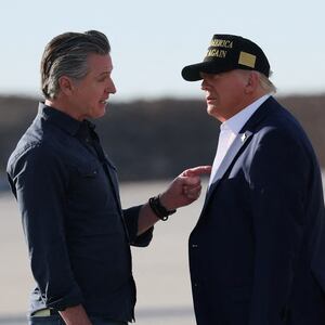 Gavin Newsom talks to Donald Trump upon Trump's arrival to tour areas affected by wildfires.