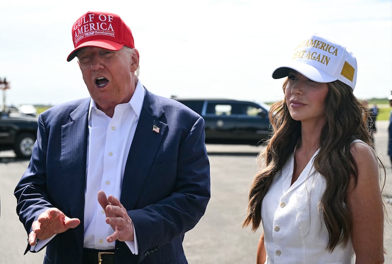 Donald Trump and Kristi Noem.
