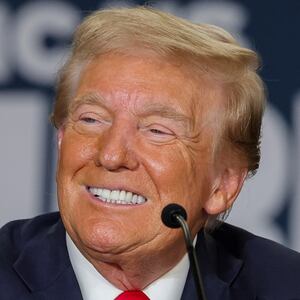Republican presidential nominee and former U.S. President Donald Trump smiles during a Hispanic roundtable at Beauty Society on October 12, 2024 in North Las Vegas, Nevada.