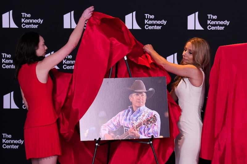 A photo of country music artist George Strait is unveiled as U.S. President Donald Trump announces the nominees for the annual Kennedy Center Honors.
