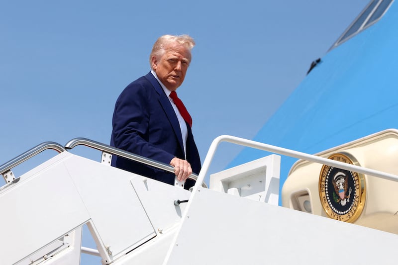 U.S. President Donald Trump boards Air Force One as he departs for Michigan to attend a rally to celebrate his first 100 days in office, at Joint Base Andrews in Maryland, U.S., April 29, 2025. REUTERS/Evelyn Hockstein/File Photo
