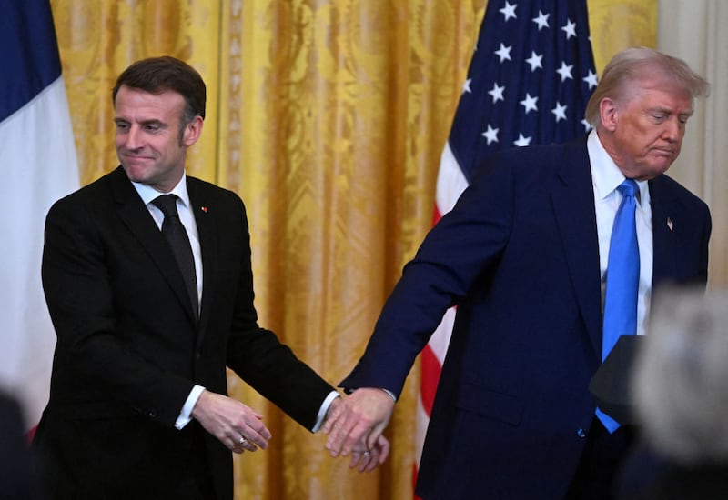 U.S. President Donald Trump and French President Emmanuel Macron hold a joint press conference in the East Room to the White House in Washington, DC, on February 24, 2025.