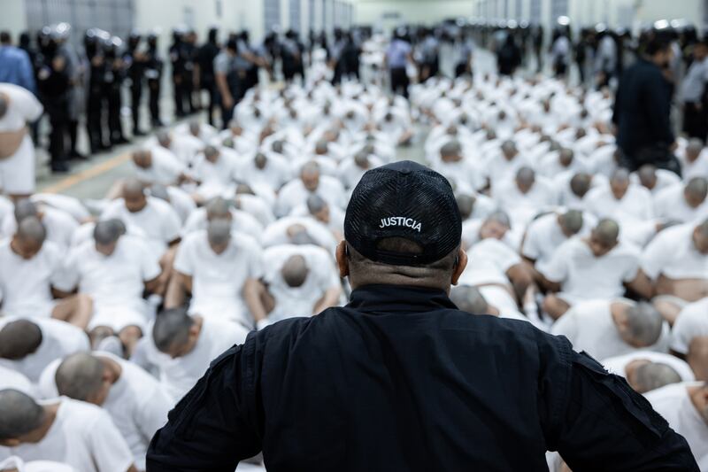 More than 250 suspected gang members arrive in El Salvador by plane.