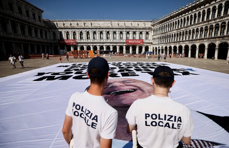 Anti-Bezos banner with local police looking on