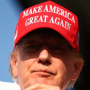 Donald Trump wearing MAGA hat.