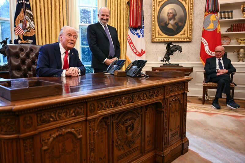 Rupert Murdoch looks on as President Donald Trump speaks to the press after signing an executive order to create a U.S. sovereign wealth fund.