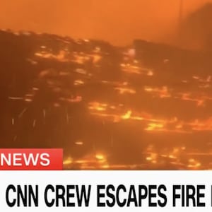A screenshot from a CNN broadcast shows a raging wildfire in the Los Angeles area on January 7, 2025.