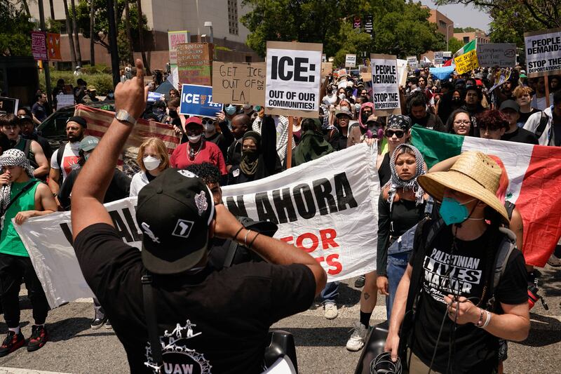 People attend a rally in downtown Los Angeles, California, U.S. June 9, 2025.