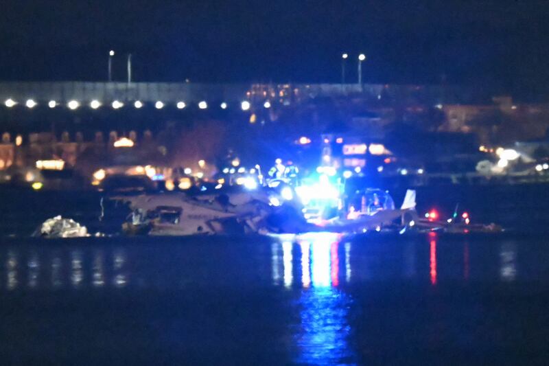 Part of the wreckage is seen as rescue boats search the waters of the Potomac River after a plane on approach to Reagan National Airport crashed into the river outside Washington, DC, January 30, 2025.