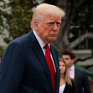 President Donald Trump talks to reporters during the White House Egg Roll.