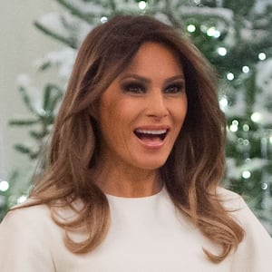 US First Lady Melania Trump walks into the East Room as she tours Christmas decorations at the White House in Washington, DC, November 27, 2017.