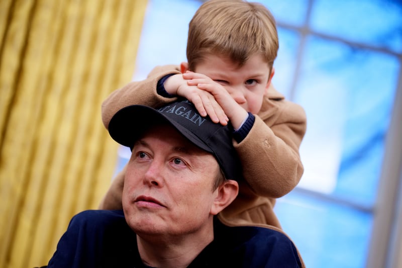 Elon Musk and son X in the Oval Office.