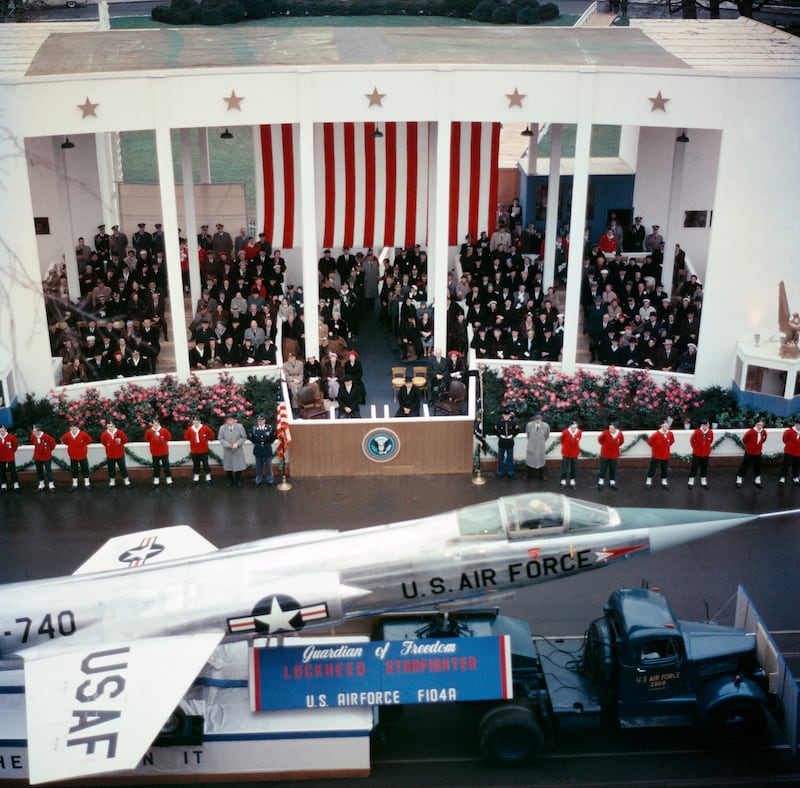 President Dwight D. Eisenhower and Vice President Richard Nixon watching the inaugural parade.