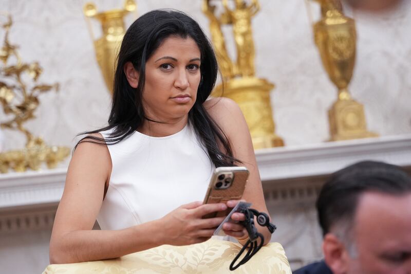 Katie Miller is pictured in the White House Oval Office as President Donald Elon Musk speak on May 30, 2025—with Musk announcing plans to leave the administration to refocus on his businesses.