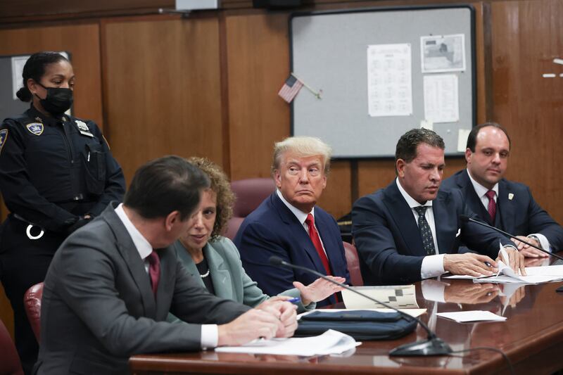 Former U.S. President Donald Trump sits in the courtroom with his attorneys (L-R) Todd Blanche, Susan Necheles, Joe Tacopina and Boris Epshteyn during his arraignment at the Manhattan Criminal Court April 4, 2023 in New York City.