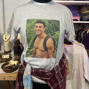 A $35 T-shirt bearing the likeness of Luigi Mangione, who was accused earlier this week of murdering UnitedHealthcare CEO Brian Thompson.
