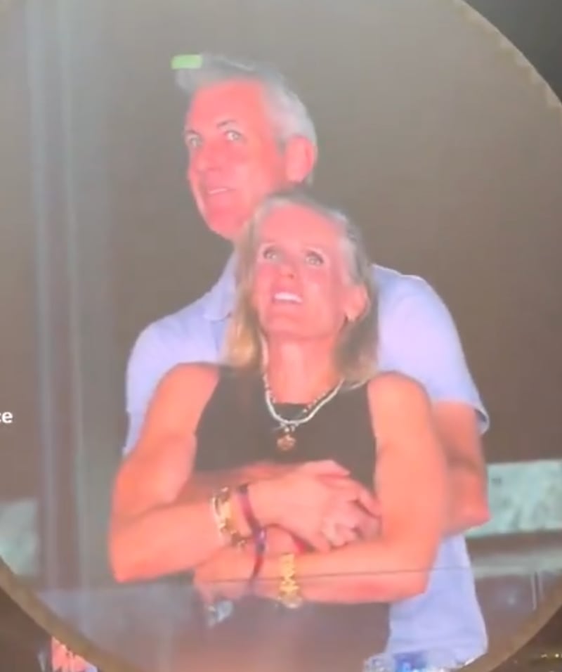 The two appeared to be having a good time before being placed on a Jumbotron at Gillette Stadium.