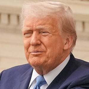 President Donald Trump blasted Vladimir Putin as "playing with fire" on social media on Tuesday after delivers remarks on Memorial Day on May 26, 2025.