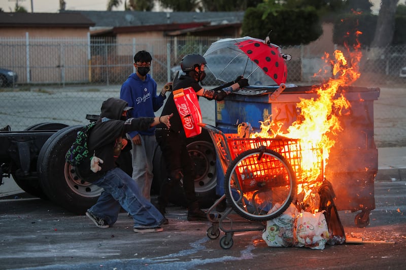 A firework sent by protesters explodes near by the Los Angeles Sheriff Department officers during immigration protest on June 7, 2025 in Paramount, California.