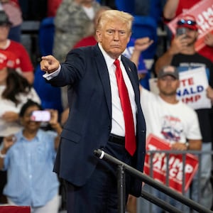 Donald Trump points to the crowd during a campaign rally at the Georgia State University Convocation Center in Atlanta, Georgia,