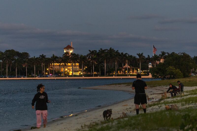 A flag flies at full height at Mar-a-Lago on Saturday evening.