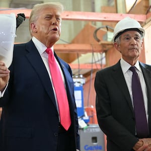 President Donald Trump speaks with Federal Reserve chair Jerome Powell as he visits the Federal Reserve on July 24, 2025 after attacking the chair as a "dummy," "stupid" and "too late" for months on social media and in comments to the press at the White House.
