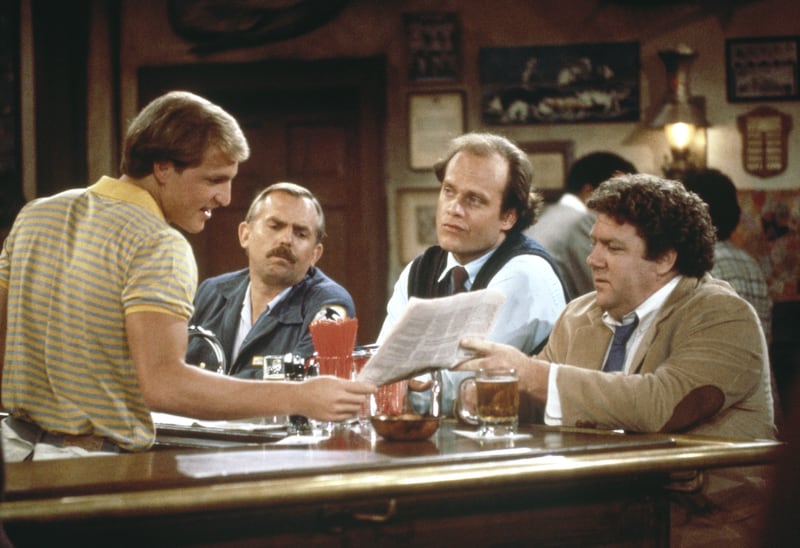 (l-r) Woody Harrelson as Woody Boyd, John Ratzenberger as Cliff Clavin, Kelsey Grammer as Dr. Frasier Crane, George Wendt as Norm Peterson in Cheers.