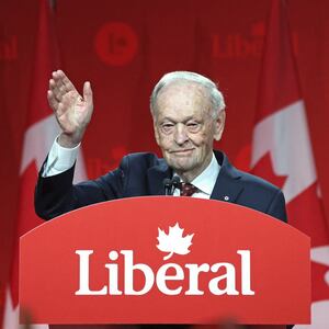 Canada's former Prime Minister Jean Chretien waves as he speaks after Mark Carney was elected as Canada's Liberal Leader and Prime Minister-elect during the election of the new Liberal Party leader, in Ottawa on March 9, 2025.