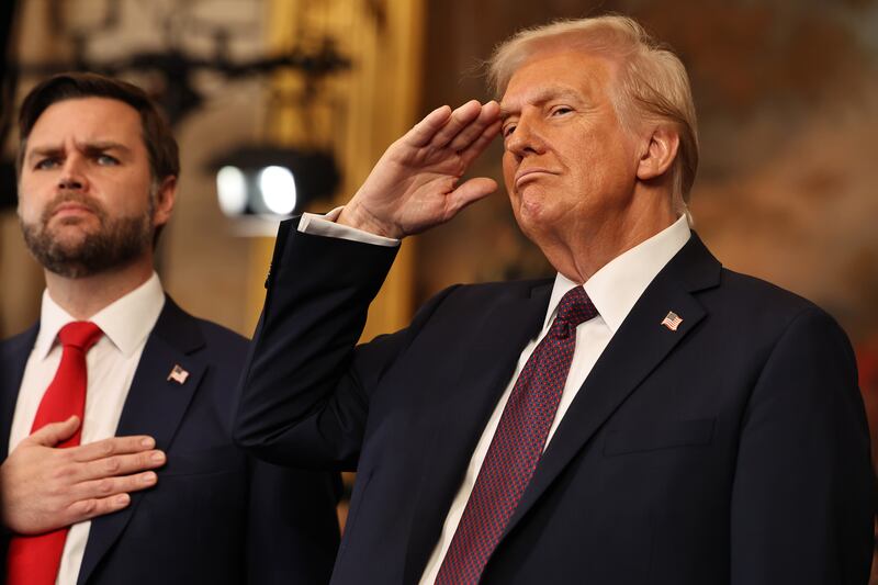 U.S. President Donald Trump salutes as he and U.S. Vice President JD Vance listen to the performance of the national anthem during their inauguration ceremonies in the Rotunda of the U.S. Capitol on January 20, 2025 in Washington, DC.