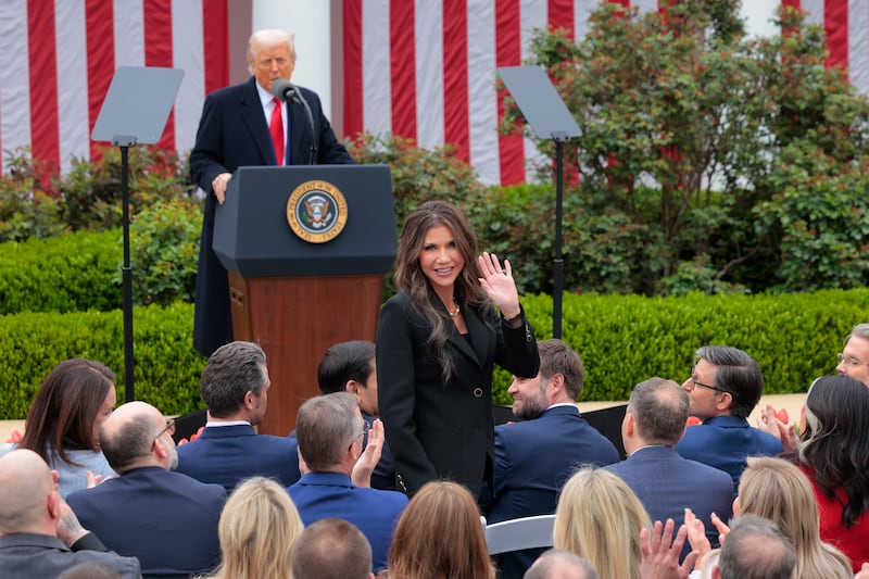Kristi Noem and Donald Trump.