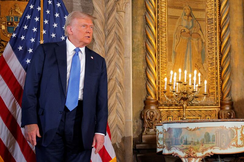 U.S. President-elect Donald Trump listens to a question from a reporter after delivering remarks at Mar-a-Lago in Palm Beach, Florida, U.S., December 16, 2024.