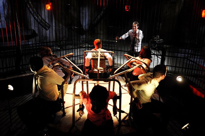 People in a carousel with shotguns facing them in 'Saw VI'