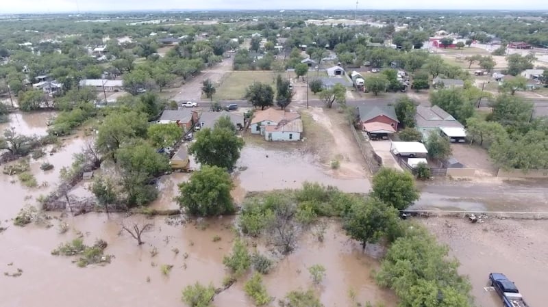 A drone view shows flooded houses, following torrential rains that unleashed flash floods along the Guadalupe River in San Angelo, Texas, U.S., June 4, 2025.