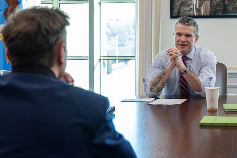 Secretary of Defense Pete Hegseth welcomes Elon Musk during the latter's visit to the Pentagon in Arlington, Virginia on March 21, 2025.