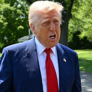 President Donald Trump praised billionaire Jeff Bezos before heading to Michigan on April 29 after Amazon scrapped a plan to display tariff costs for consumers.