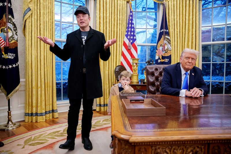 Tesla and SpaceX CEO Elon Musk, accompanied by U.S. President Donald Trump (R), and his son X Musk, speaks during an executive order signing in the Oval Office at the White House on February 11, 2025 in Washington, DC.