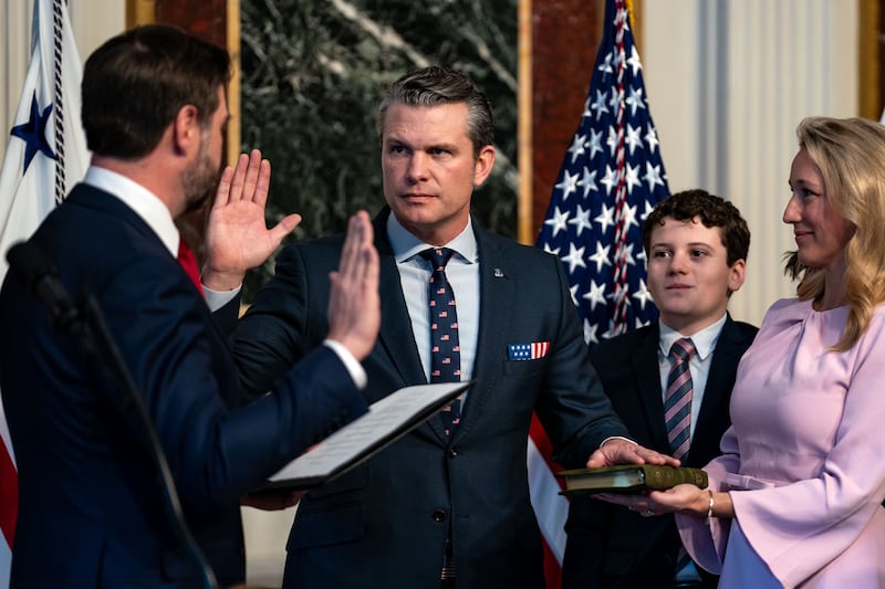 U.S. Vice President J.D. Vance (L) swears in Secretary of Defense Pete Hegseth.