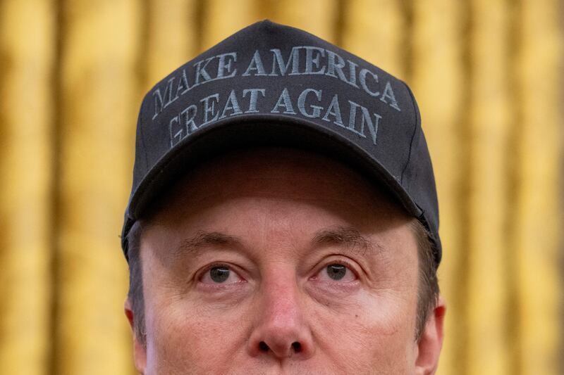 Tesla and SpaceX CEO Elon Musk looks on before US President Donald Trump signs executive orders in the Oval Office of the White House in Washington, DC, on February 11, 2025.