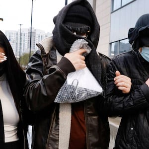 Alexander Smirnov, center, a confidential human source with the FBI, leaves the Lloyed George U.S. Courthouse, on Tuesday, Feb. 20, 2024, in Las Vegas. Smirnov is accused of falsely stating that executives with the Ukrainian energy company Burisma paid Hunter and Joe Biden $5 million each in 2015 or 2016. (Bizuayehu Tesfaye/Las Vegas Review-Journal/Tribune News Service via Getty Images)
