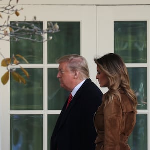 U.S. President Donald Trump and first lady Melania Trump walk back to the Oval Office after the pardoning of the 72nd National Thanksgiving Turkeys during ceremonies in the Rose Garden of the White House in Washington, U.S., November 26, 2019.