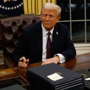 President Donald Trump signs executive orders in the Oval Office on January 20, 2025 in Washington, DC.