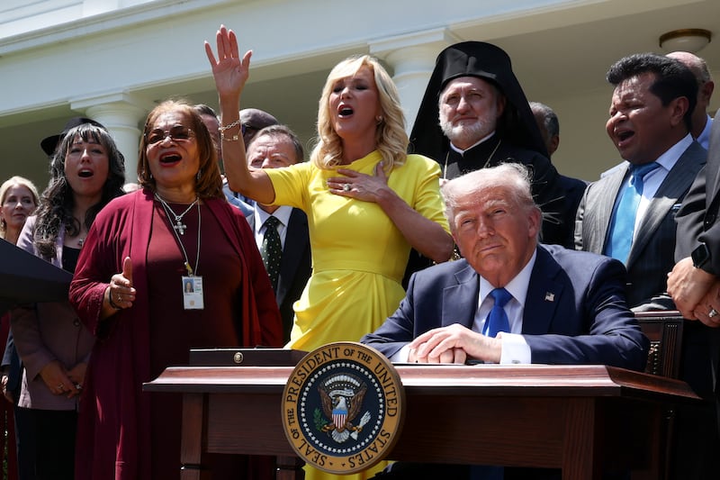 Trump named Paula White (center) to lead the White House Faith Office, which he established via executive order to "bring religion back" and to "protect Christians."