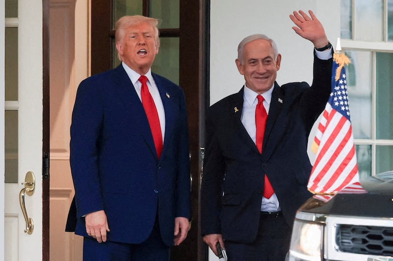 U.S. President Donald Trump speaks as Israeli Prime Minister Benjamin Netanyahu waves following a meeting in the White House, in Washington, U.S., April 7, 2025.