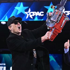 A new report shows that DOGE under Elon Musk, pictured with a chainsaw on February 20, actually wasted $21.7 billion despite its mission to cut government spending.