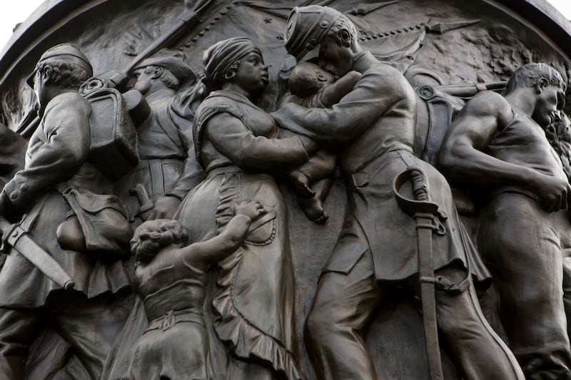 The memorial includes a Black woman depicted as a “Mammy” figure holding a white officer’s baby, as well as an enslaved man following his owner to battle.